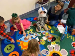 kids doing a puzzle in kids church