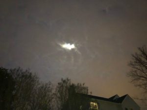 clouds over a house at night