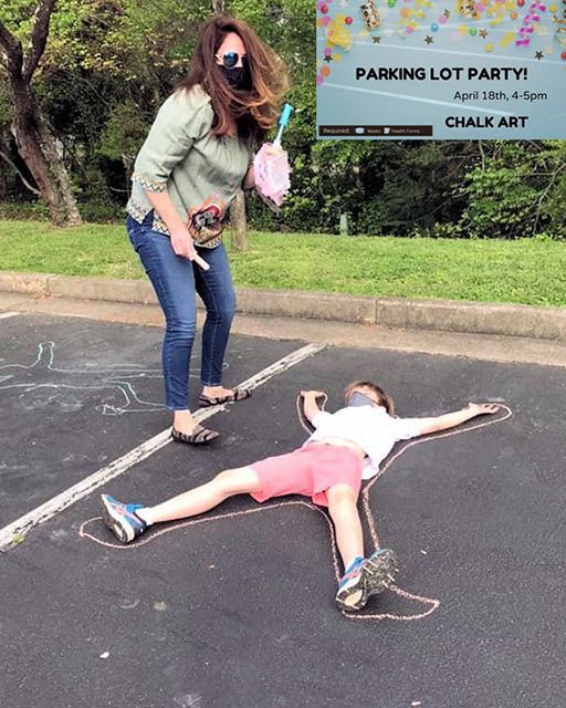 drawing a chalk line around a kid